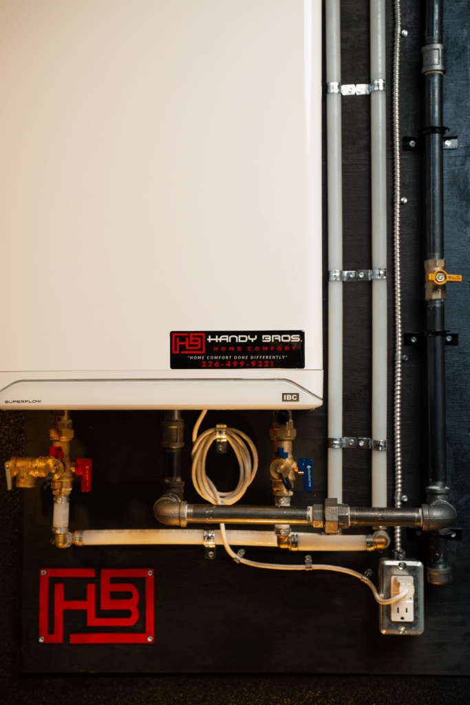 A modern tankless water heater mounted on a wall, providing energy-efficient and on-demand hot water for a home.