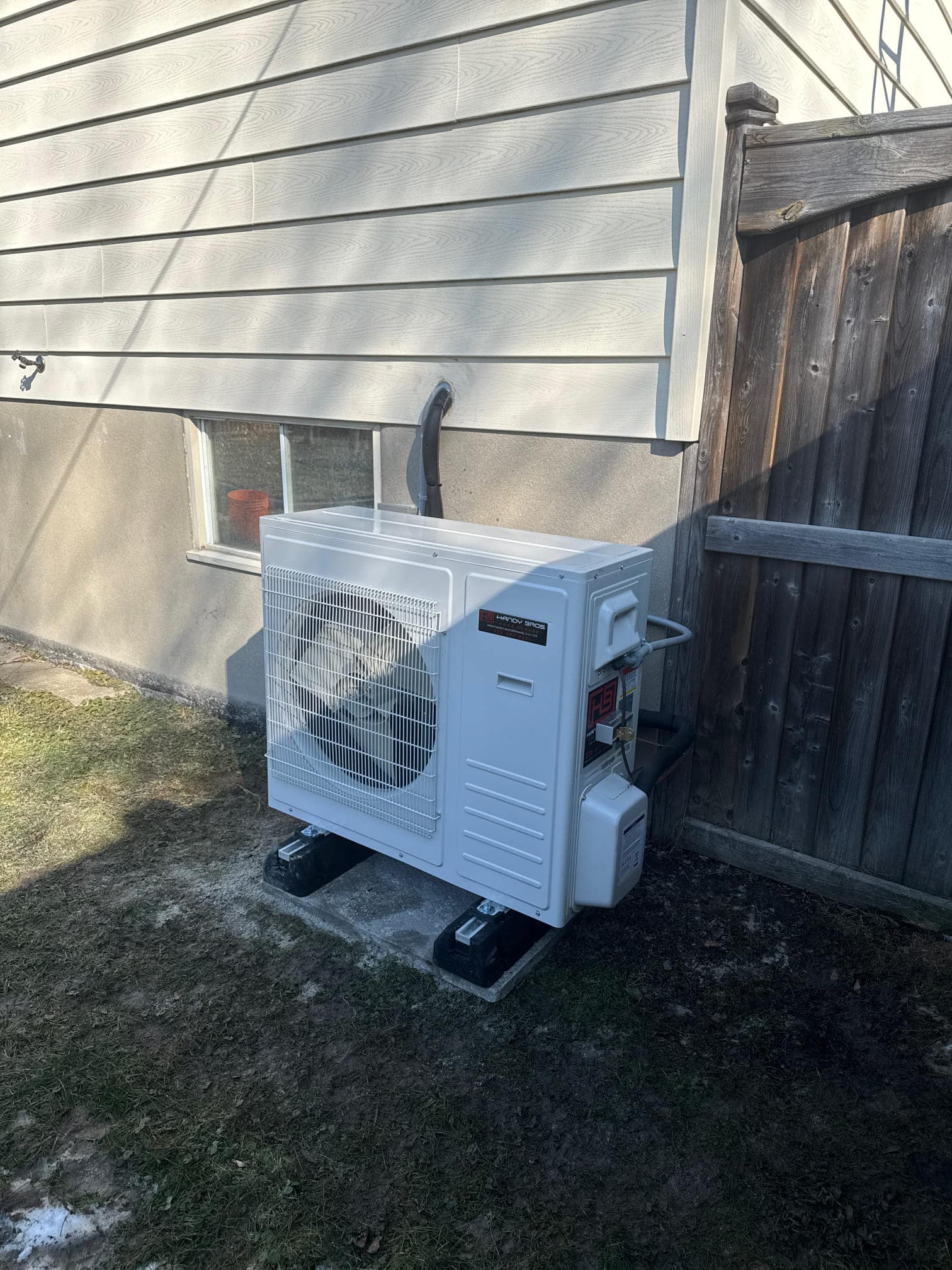 Heat pump unit installed outside a home